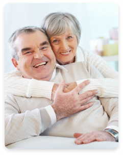 senior-couple-hugging-home